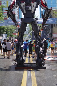 People walking on road in city