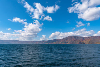 Scenic view of sea against blue sky