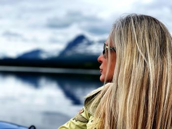 Portrait of woman against sky