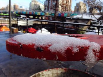 Close-up of snow on city during winter
