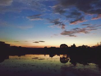 Scenic view of lake against sky during sunset