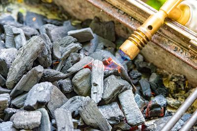 High angle view of blow torch burning coal