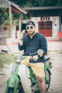 Young woman riding sunglasses on motorcycle