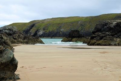 Scenic view of beach against sky