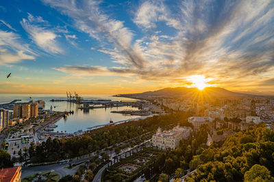 High angle view of buildings against sky during sunset