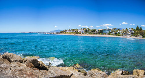 Scenic view of sea against blue sky