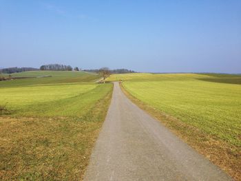 Road passing through field