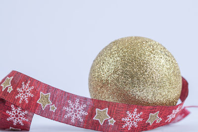 Close-up of christmas decorations over white background