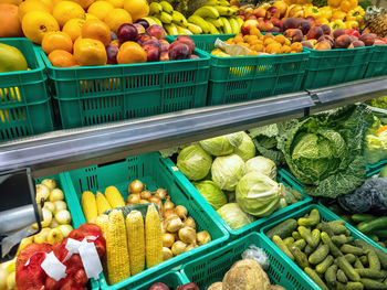 Greengrocer with racks full of vegetables and fruit