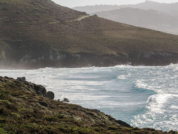 Scenic view of sea against mountain