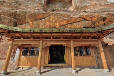 0980 wooden porch-cave temple-brass cornice-gilded lotus. thirtythree heaven grottoes-zhangye-china.