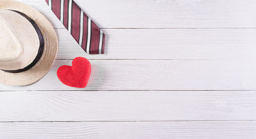 Directly above shot of heart shape on white table