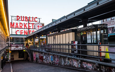 Information sign in city against clear sky