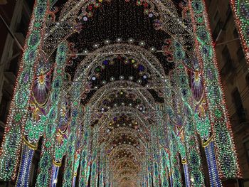 Low angle view of illuminated christmas tree at night