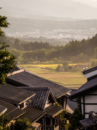 High angle view of houses and buildings against sky