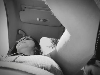 Portrait of woman relaxing in car