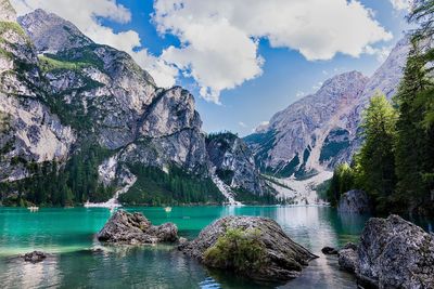 Scenic view of lake and mountains against sky