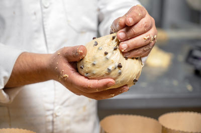 Midsection of man preparing food