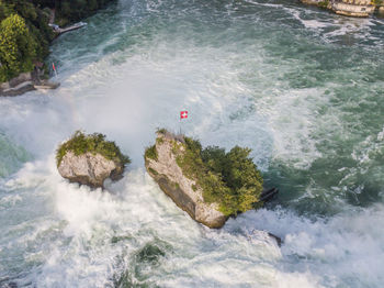 High angle view of waterfall in sea