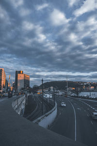 High angle view of street and buildings against sky