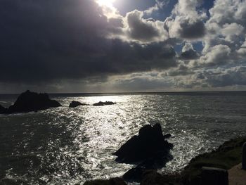 Scenic view of sea against cloudy sky