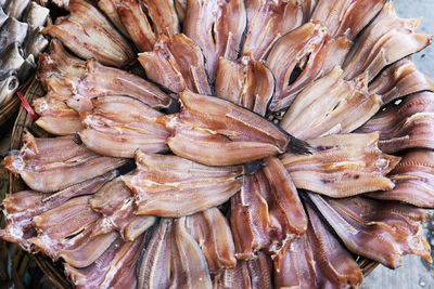 Dried fish on the bamboo grid in the sunny day