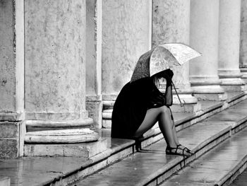 Woman sitting on steps