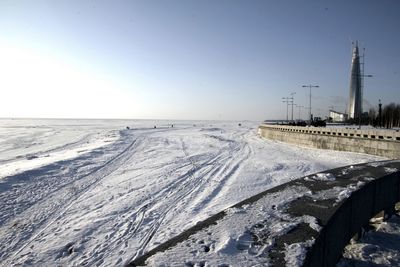 Scenic view of frozen landscape against clear sky