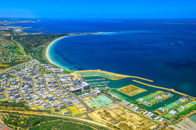 High angle view of sea and buildings against sky