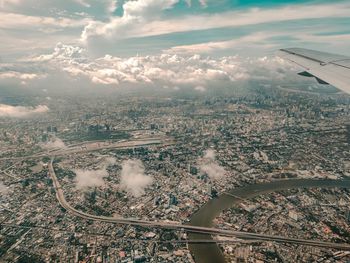 Aerial view of cityscape against sky