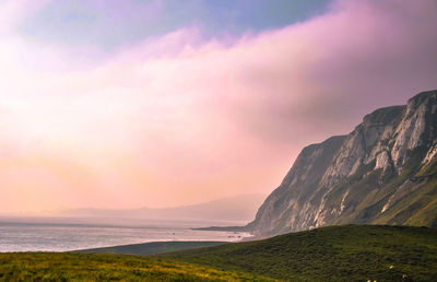 Scenic view of sea against cloudy sky