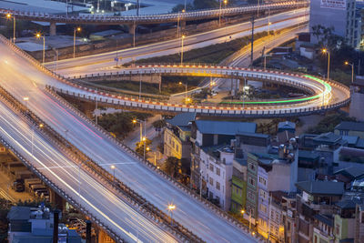 High angle view of light trails on road at night