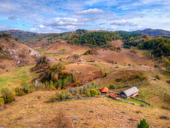 Scenic view of landscape against cloudy sky