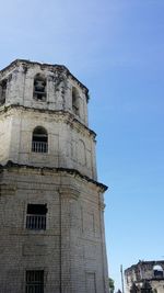 Low angle view of historical building against blue sky