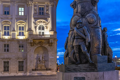 Statue of historic building against sky