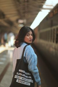 Portrait of woman standing outdoors