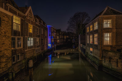 Reflection of houses in canal