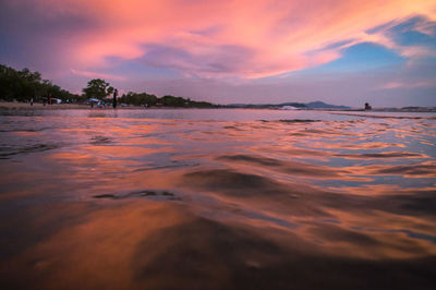 Scenic view of sea against romantic sky at sunset