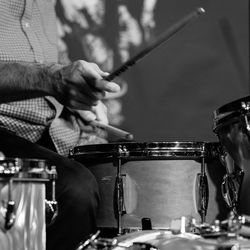 Man playing drums at music concert