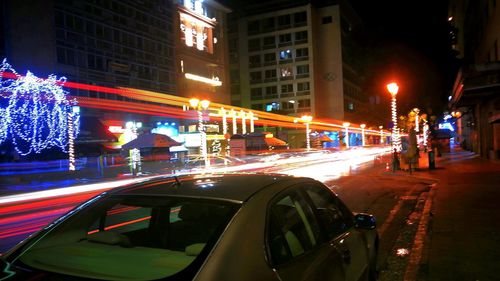 Illuminated city street at night