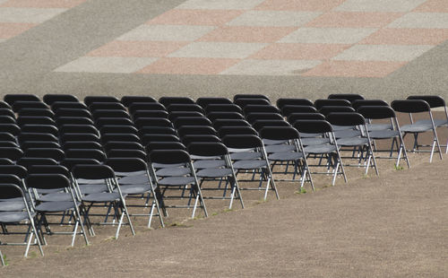High angle view of empty chairs in row