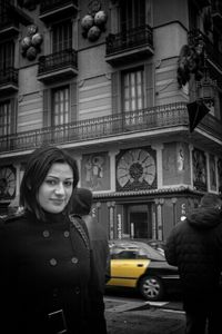 Woman standing in front of building