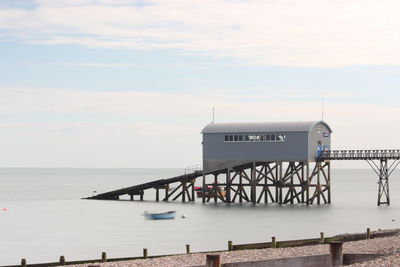 Pier over sea against sky