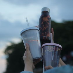 Midsection of person holding drink