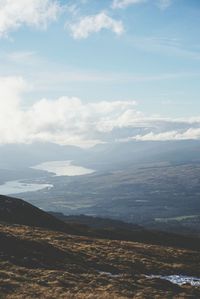 Aerial view of landscape against cloudy sky