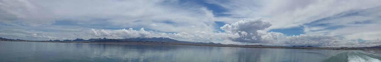 Scenic view of mountains against cloudy sky