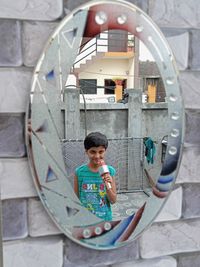 Portrait of boy holding camera