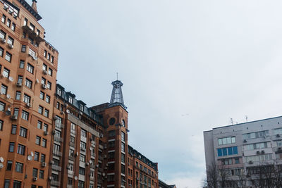 Low angle view of buildings in city against sky