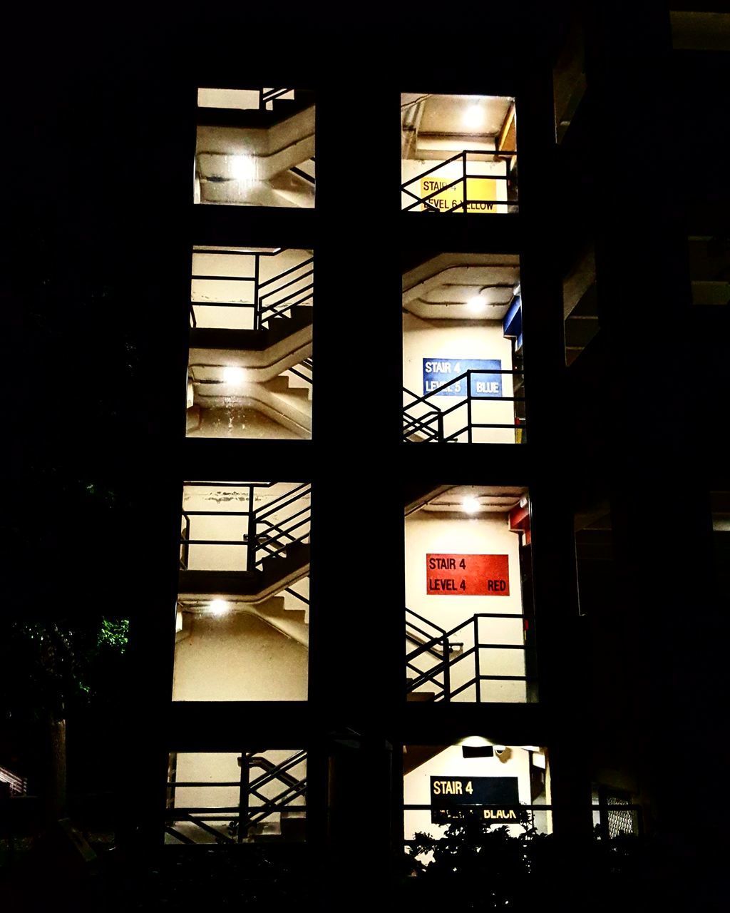 LOW ANGLE VIEW OF ILLUMINATED BUILDING
