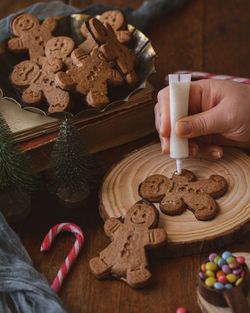 Midsection of person holding cookies